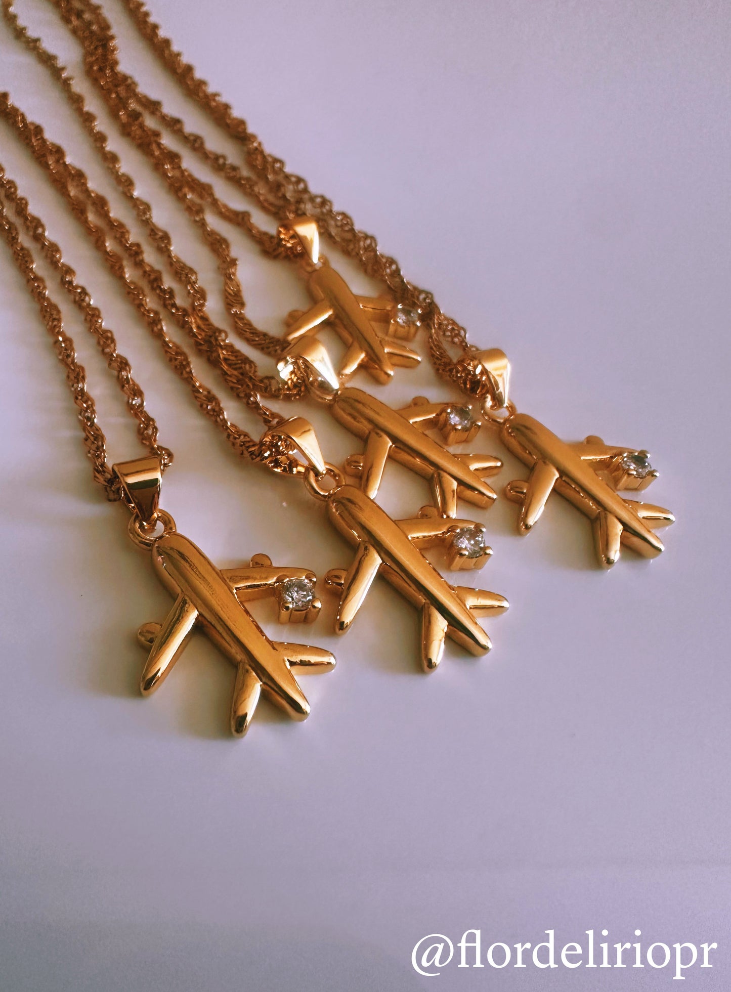 Gold plane necklace