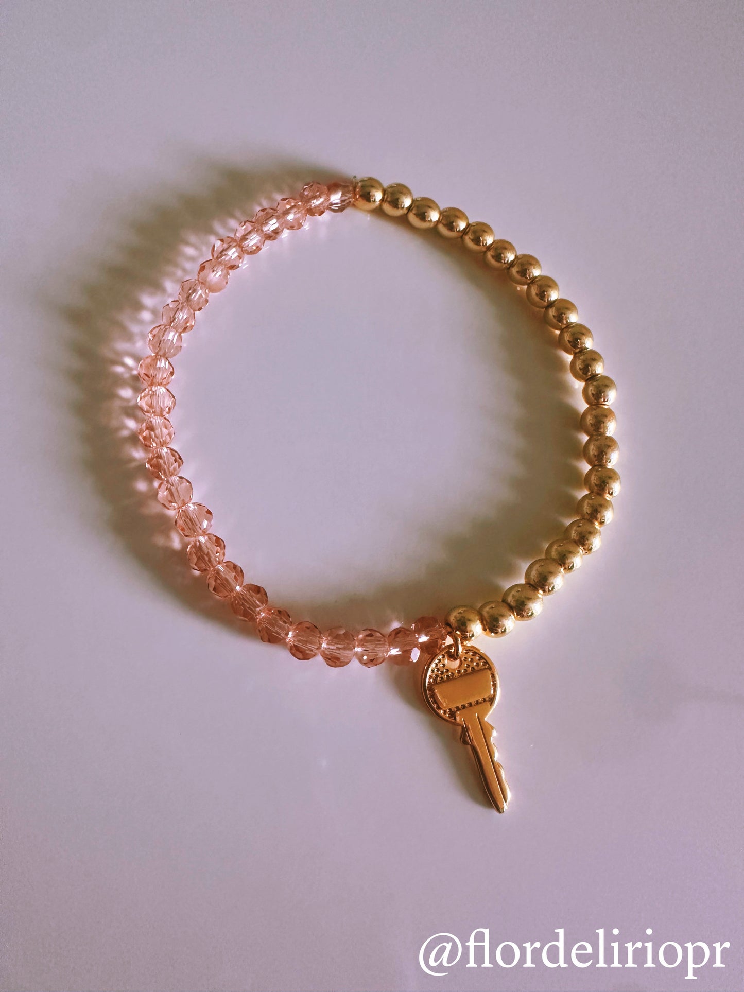 Pink crystals gold key bracelet